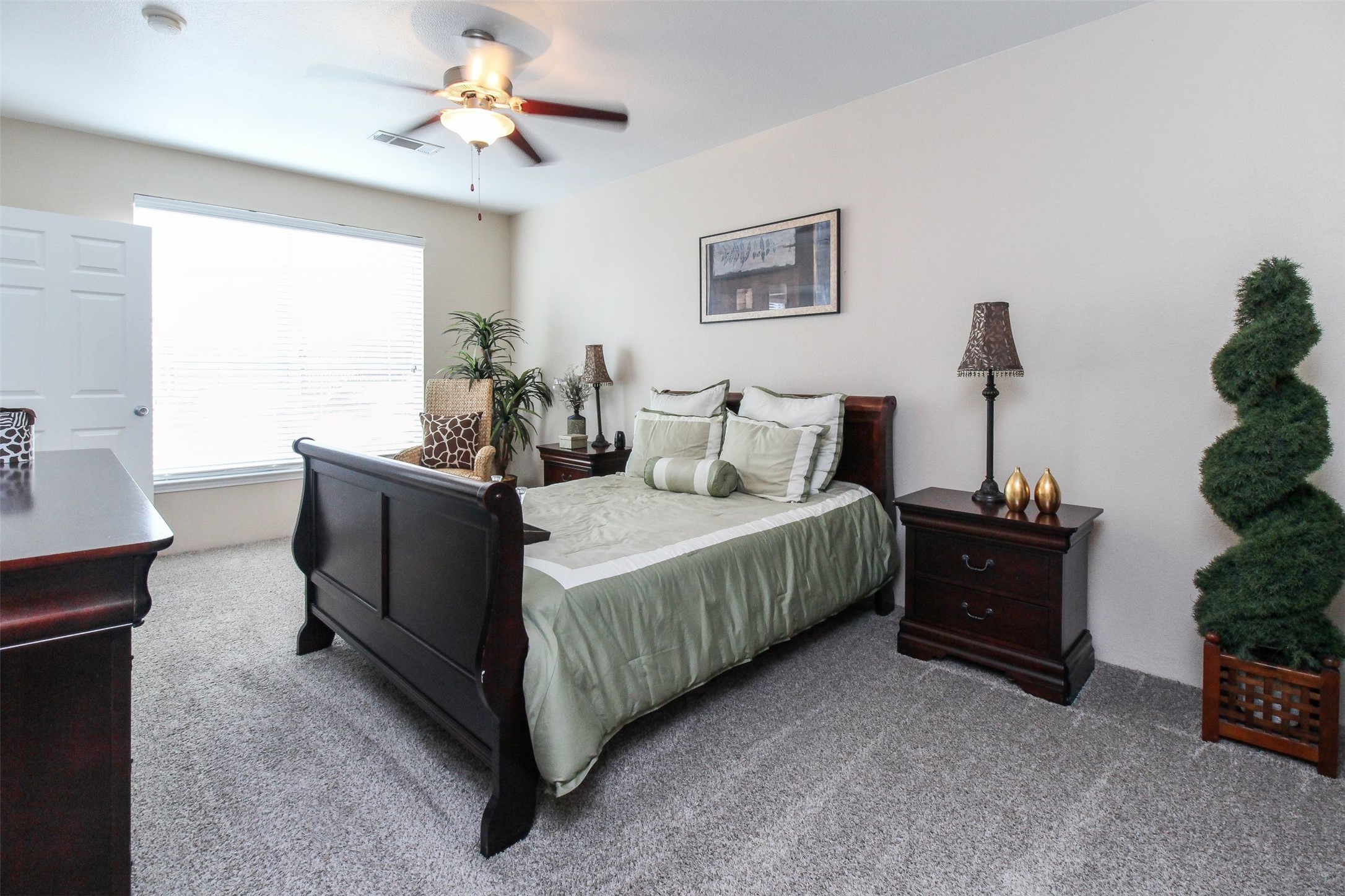 3560 Dixie Drive Houston, TX 77021 - Photo 3 of 11 a bed room with a bed and a chandelier