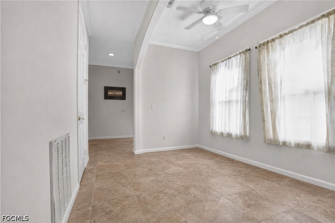 2808 34th Street Southwest Lehigh Acres, FL 33976 - Photo 8 of 14 an empty room with windows and closet