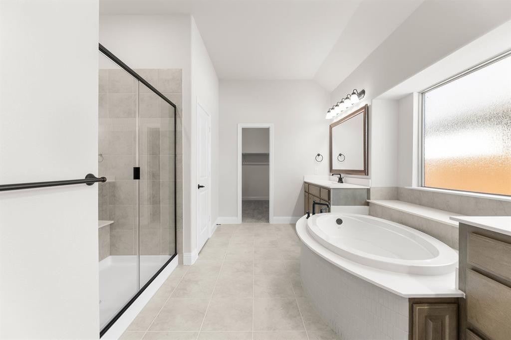 713 Seahawk Street Joshua, TX 76058 - Photo 12 of 31 a bathroom with a tub sink and mirror