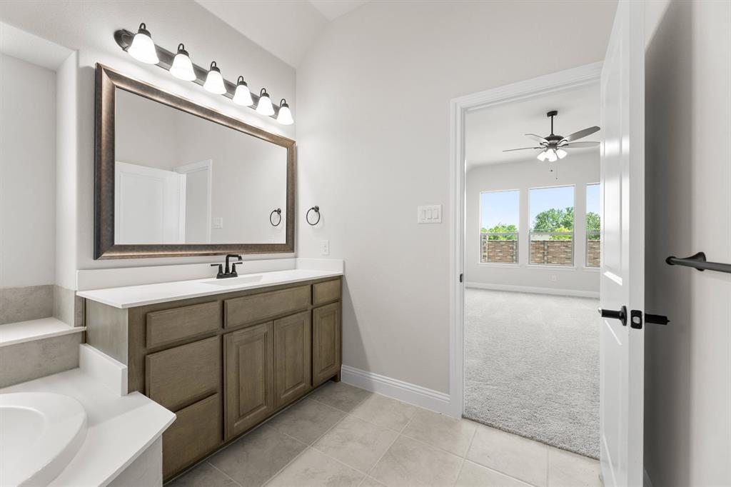 713 Seahawk Street Joshua, TX 76058 - Photo 13 of 31 a bathroom with a double vanity sink mirror and
