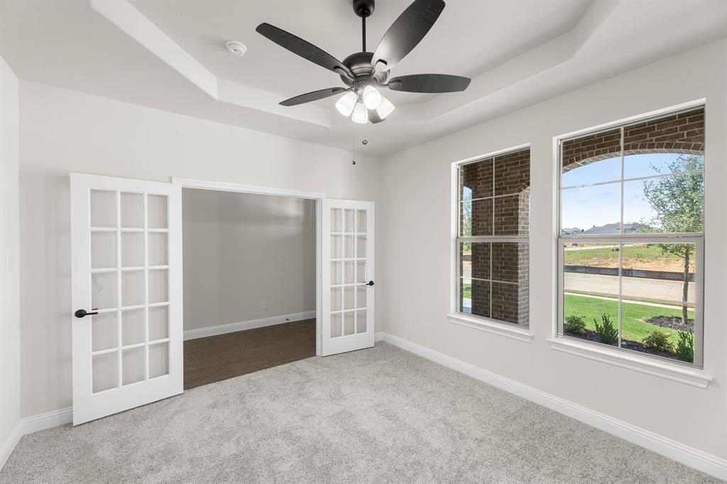 713 Seahawk Street Joshua, TX 76058 - Photo 17 of 31 an empty room with windows and closet