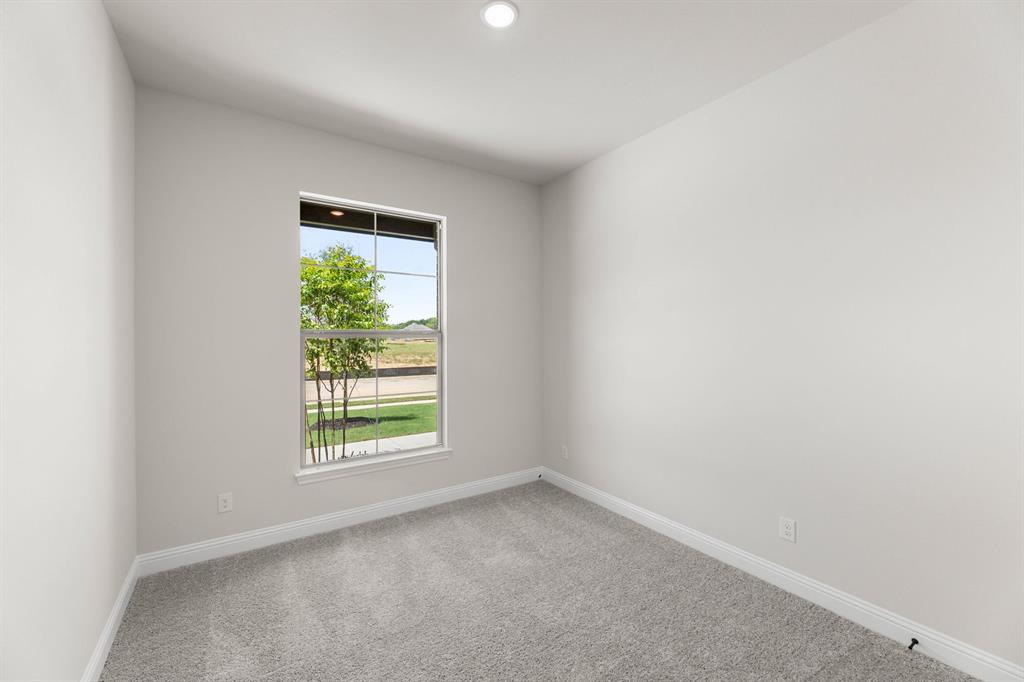713 Seahawk Street Joshua, TX 76058 - Photo 21 of 31 an empty room with windows