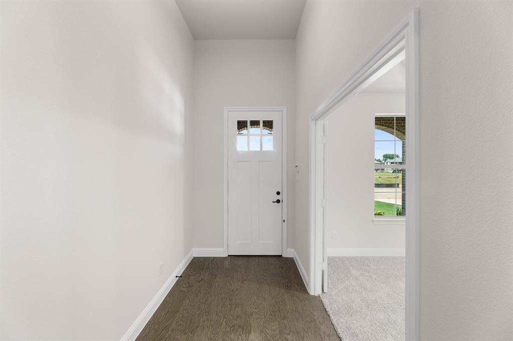 713 Seahawk Street Joshua, TX 76058 - Photo 22 of 31 a view of an entryway with wooden floor
