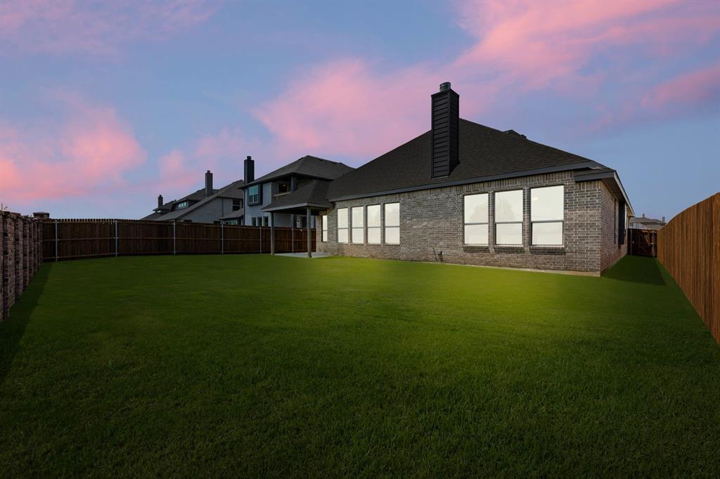 713 Seahawk Street Joshua, TX 76058 - Photo 27 of 31 a front view of a house with garden