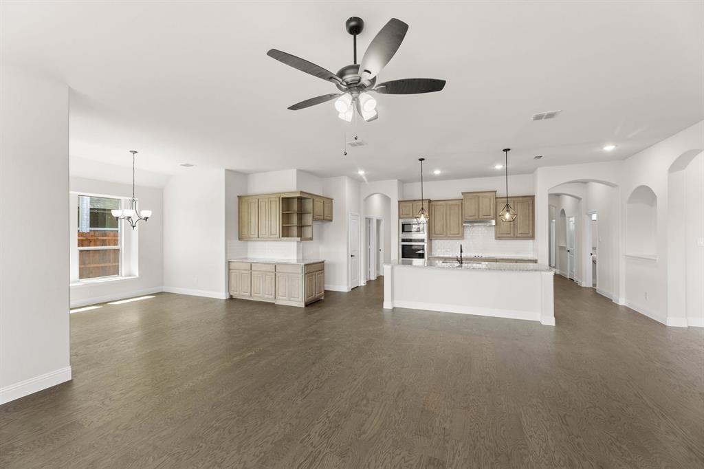 713 Seahawk Street Joshua, TX 76058 - Photo 6 of 31 a view of kitchen with cabinets and window