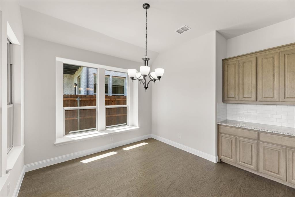 713 Seahawk Street Joshua, TX 76058 - Photo 9 of 31 a view of an empty room with a window