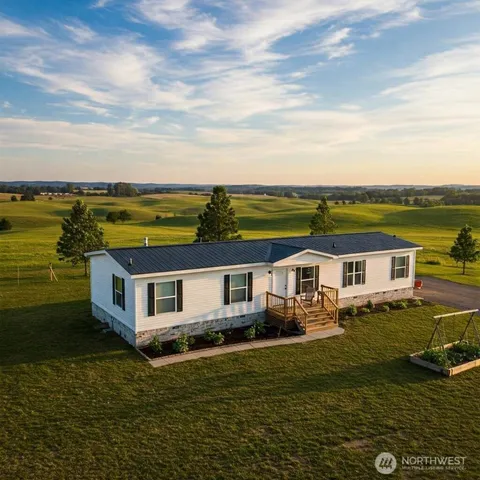 a aerial view of a house with a ocean view