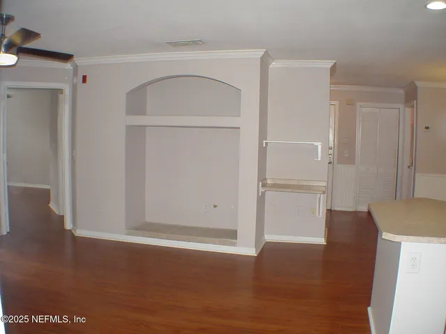 a view of a big room with balcony and furniture