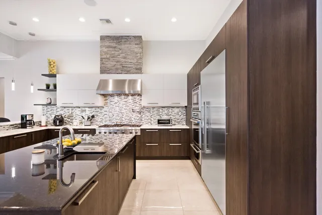 a kitchen with a sink stove and refrigerator