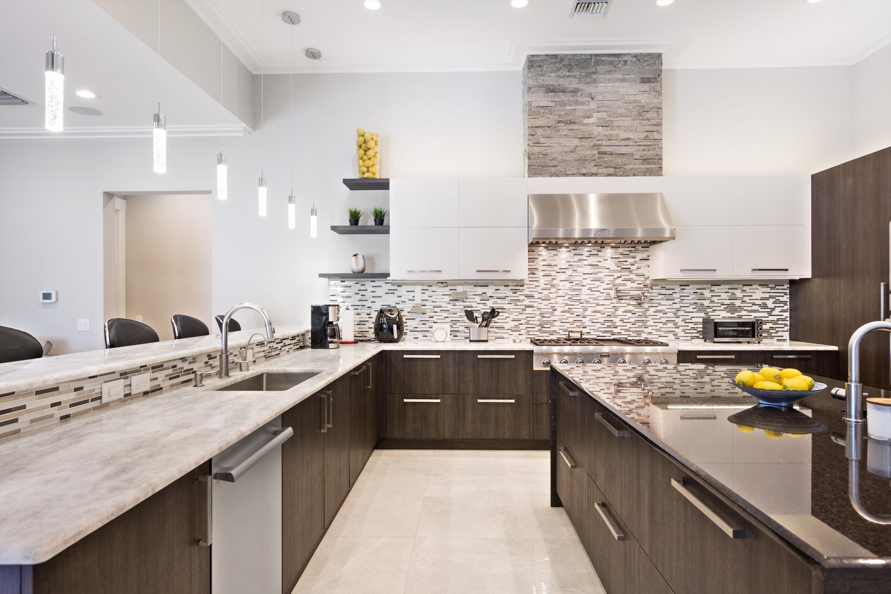 15880 Barnstormer Court Wellington, FL 33414 - Photo 13 of 48 a kitchen with a sink stove and wooden cabinets