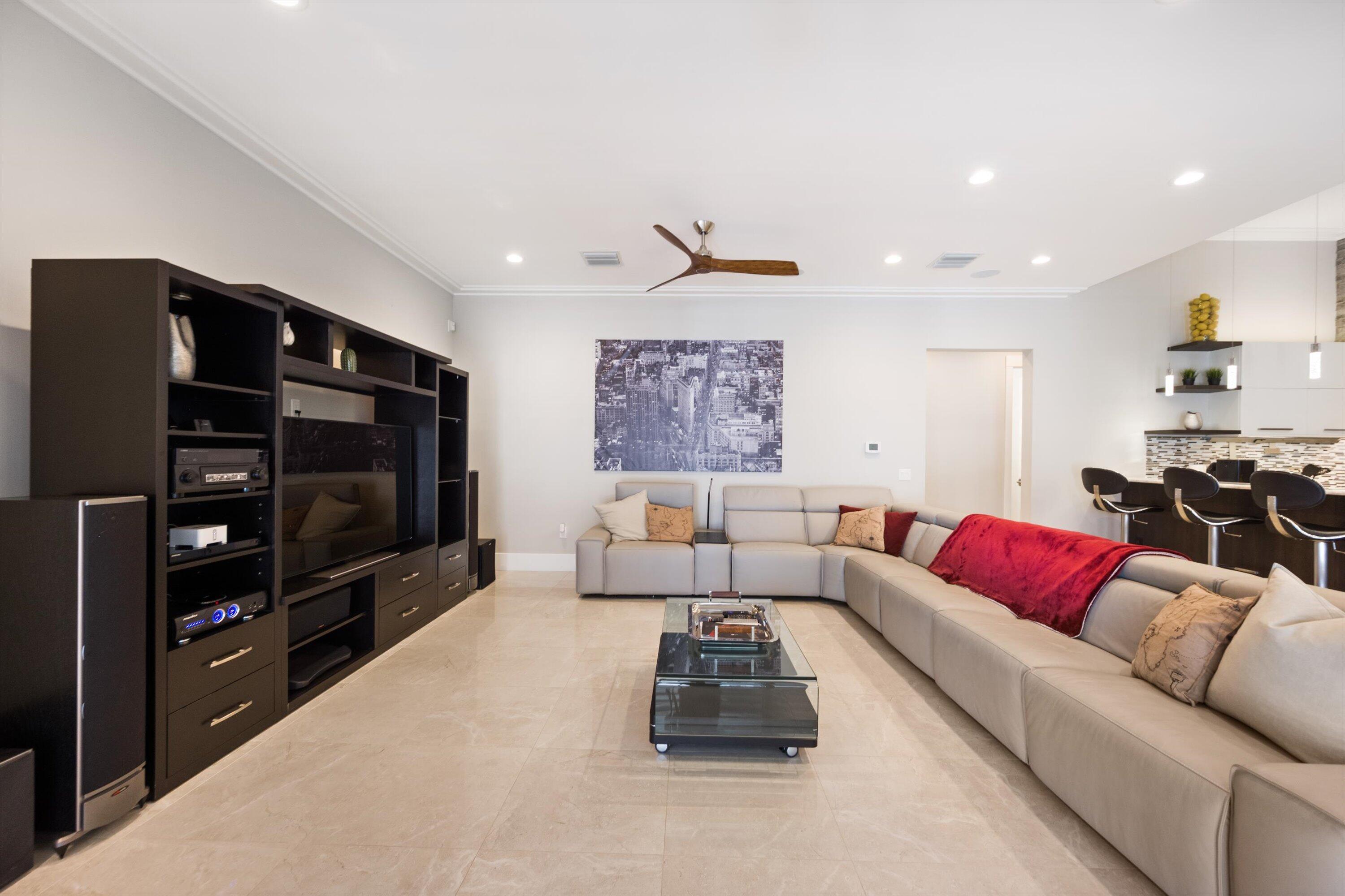 15880 Barnstormer Court Wellington, FL 33414 - Photo 17 of 48 a living room with furniture and a flat screen tv