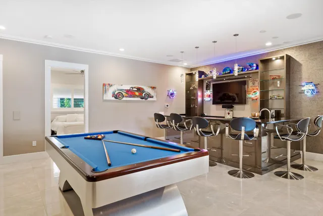 a room with gym equipment and a flat screen tv