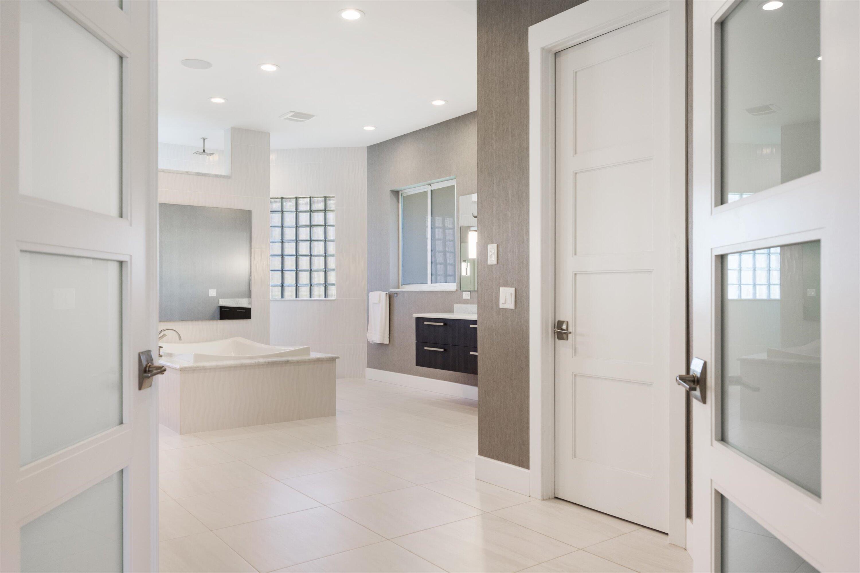15880 Barnstormer Court Wellington, FL 33414 - Photo 25 of 48 a bathroom with a bathtub and a sink