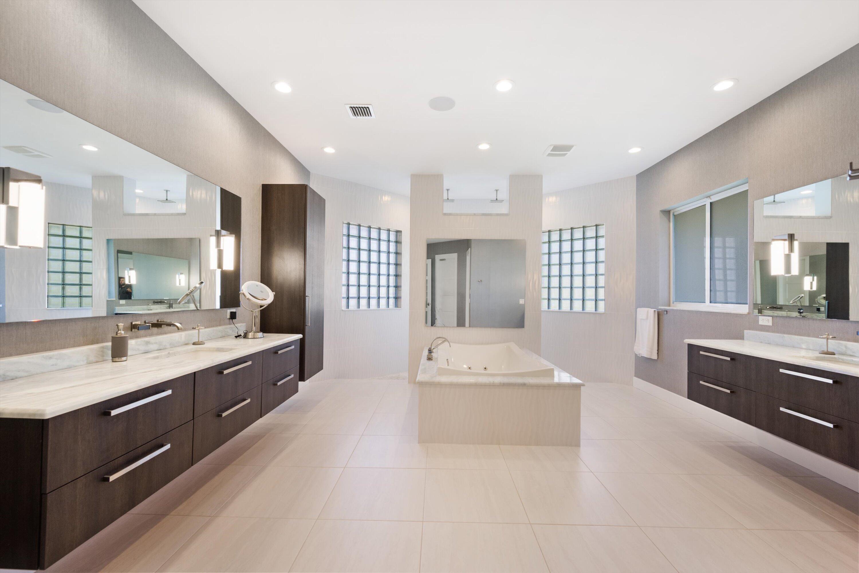 15880 Barnstormer Court Wellington, FL 33414 - Photo 26 of 48 a large white kitchen with a large window