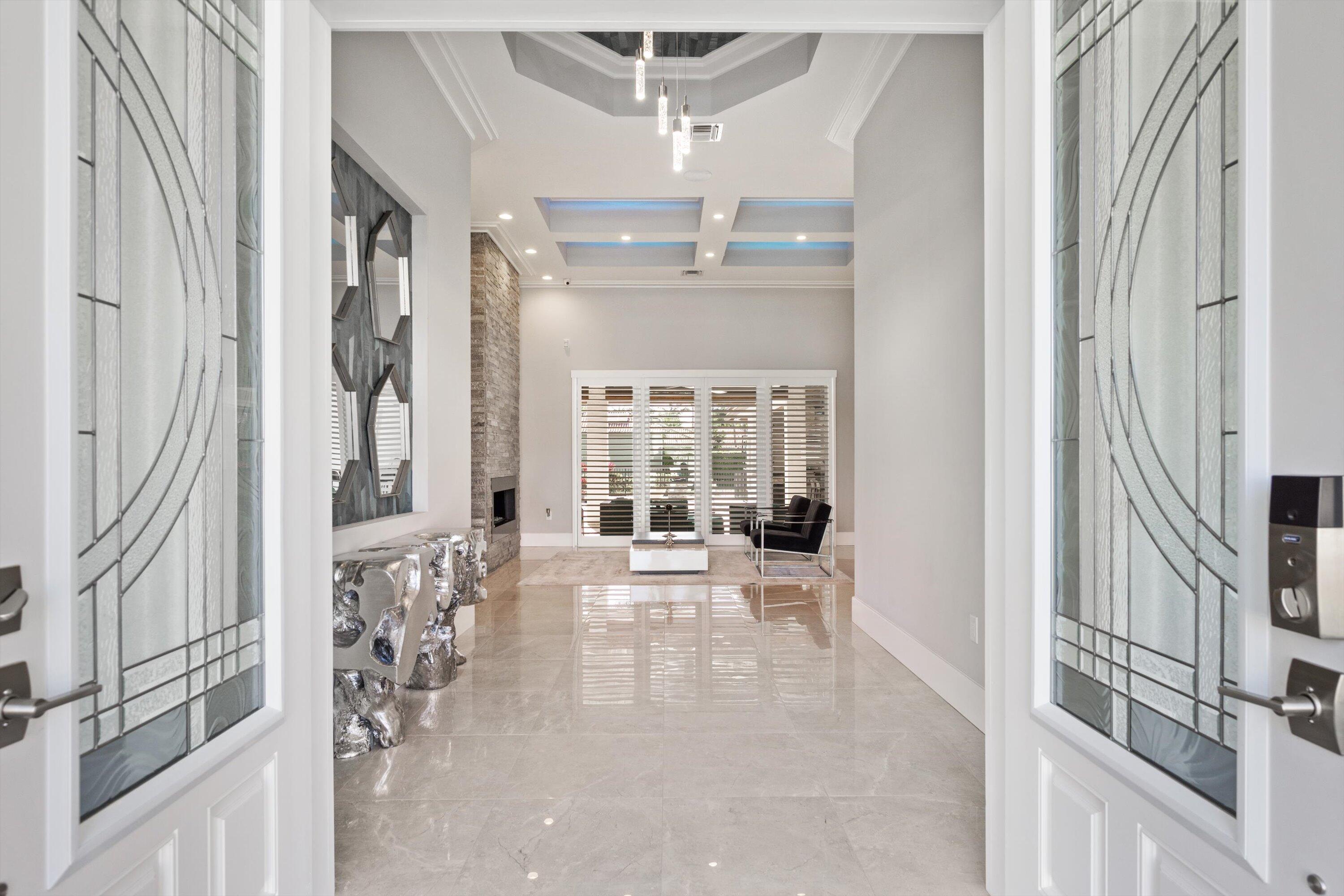 15880 Barnstormer Court Wellington, FL 33414 - Photo 3 of 48 a living room with furniture and a large window