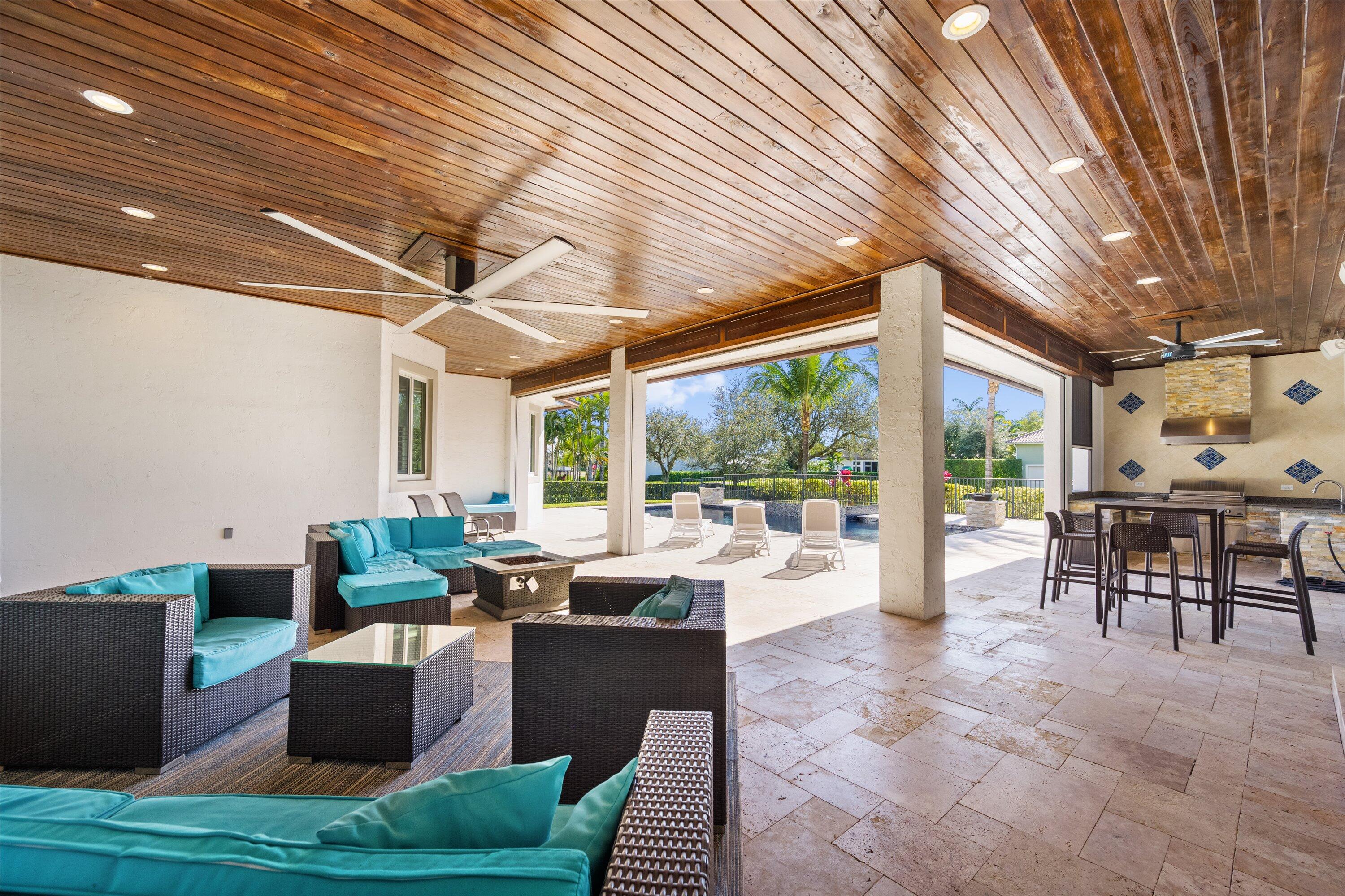 15880 Barnstormer Court Wellington, FL 33414 - Photo 38 of 48 a living room with furniture and a large window