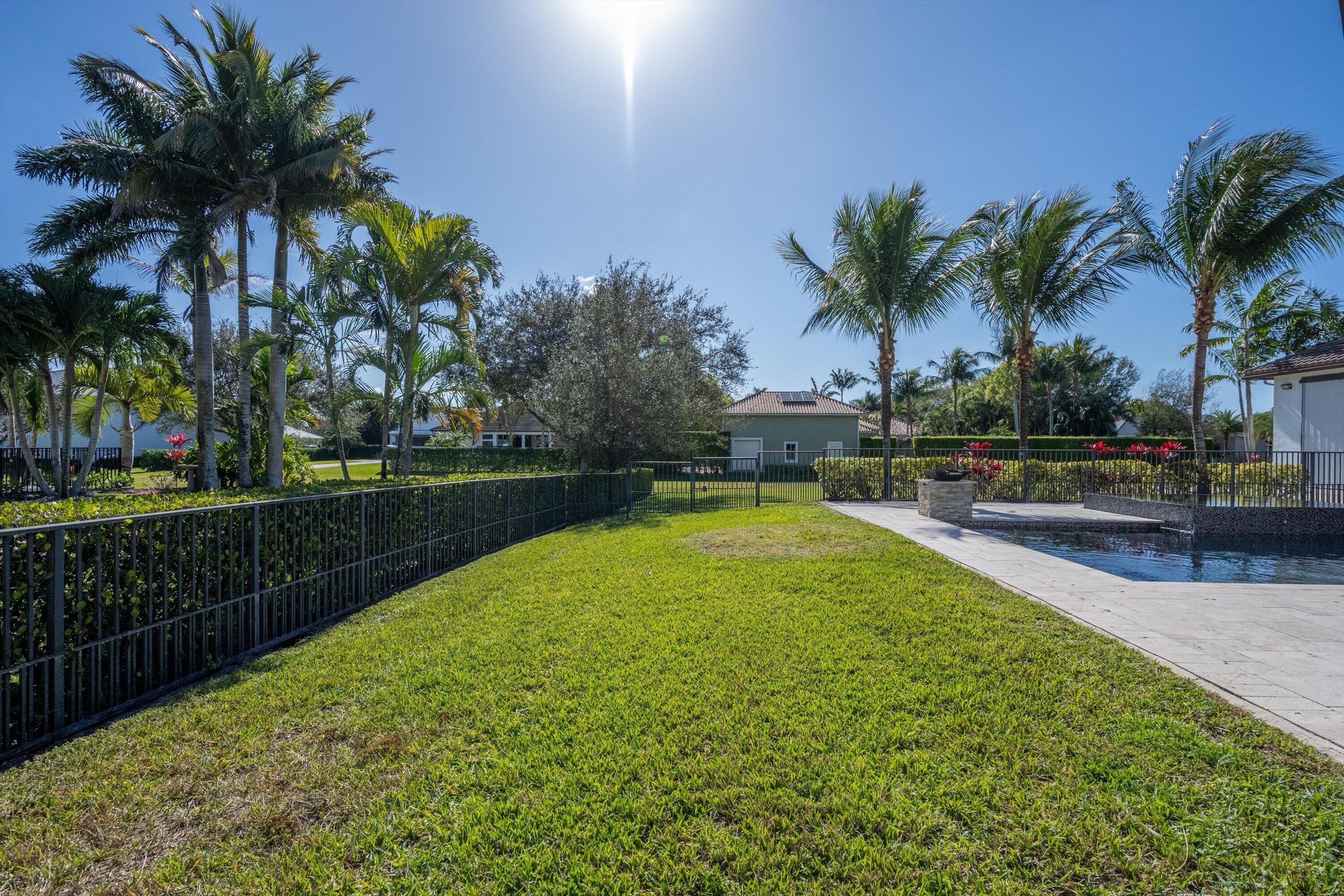 15880 Barnstormer Court Wellington, FL 33414 - Photo 48 of 48 a view of swimming pool with outdoor seating and garden