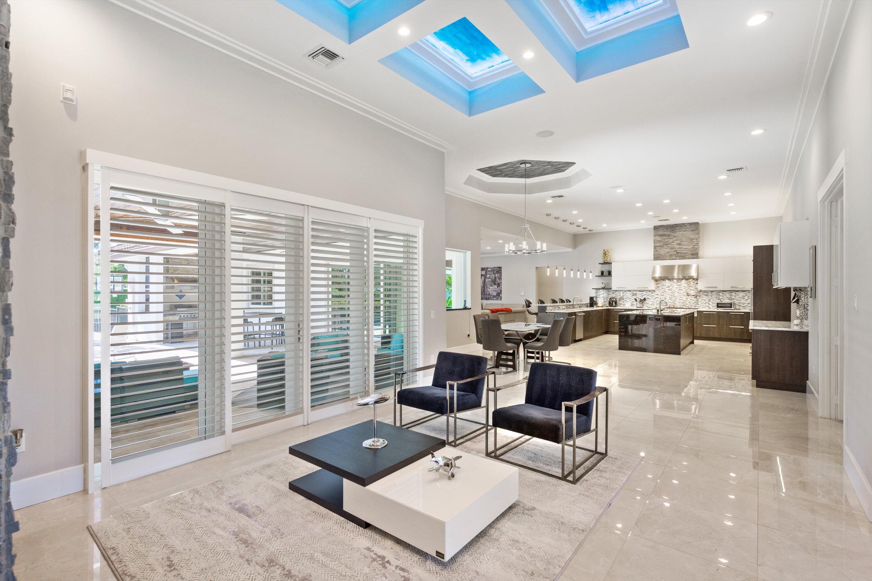 15880 Barnstormer Court Wellington, FL 33414 - Photo 7 of 48 a living room with furniture and a large window