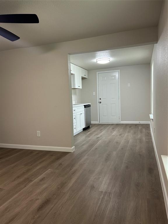 407 North Justin Avenue, Unit D Dallas, TX 75211 - Photo 8 of 15 a view of empty room with wooden floor