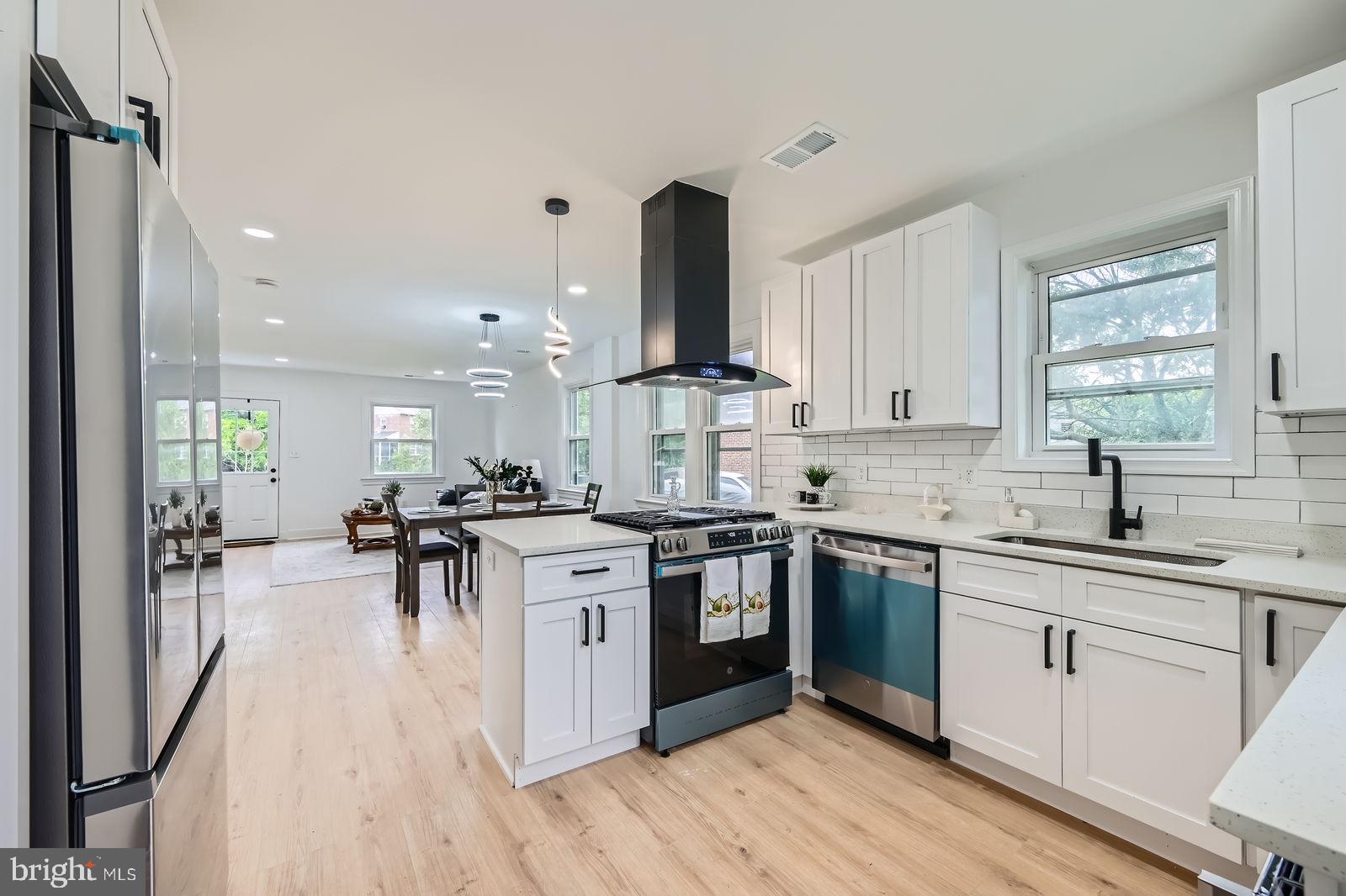 3814 Cedardale Road Baltimore, MD 21215 - Photo 1 of 28 a kitchen with lots of counter top space and appliances