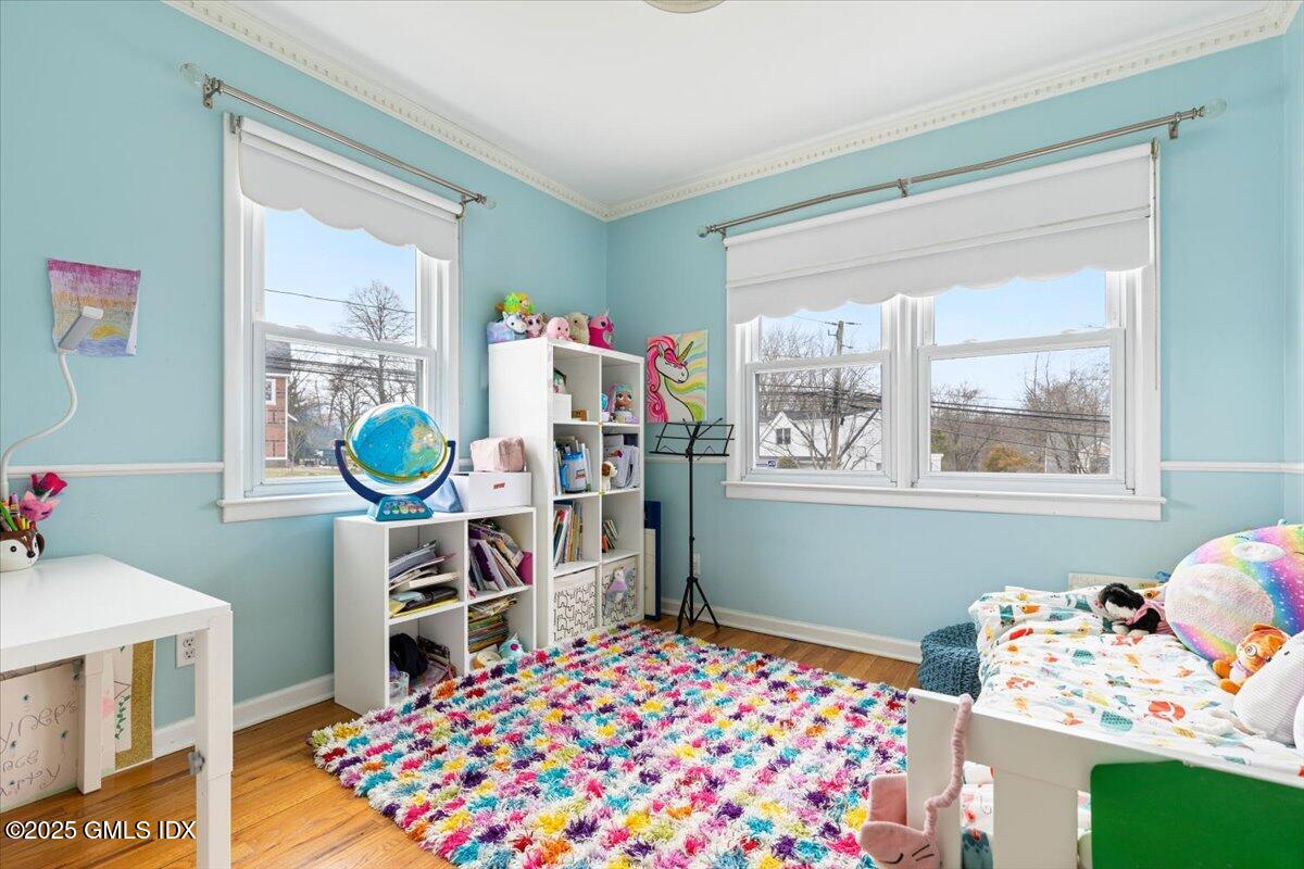 12 Mary Lane Riverside, CT 06878 - Photo 11 of 26 a bedroom with a bed and a window