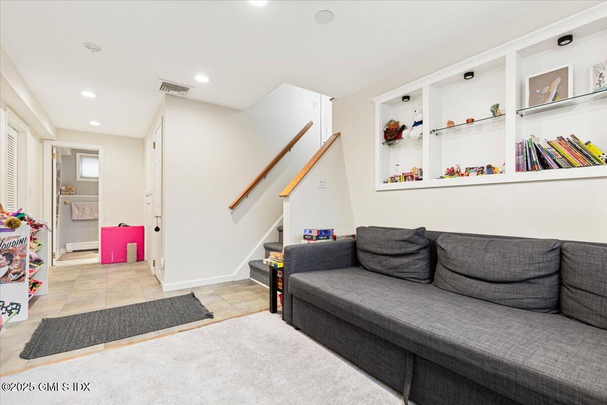 12 Mary Lane Riverside, CT 06878 - Photo 15 of 26 a living room with furniture and a wooden floor