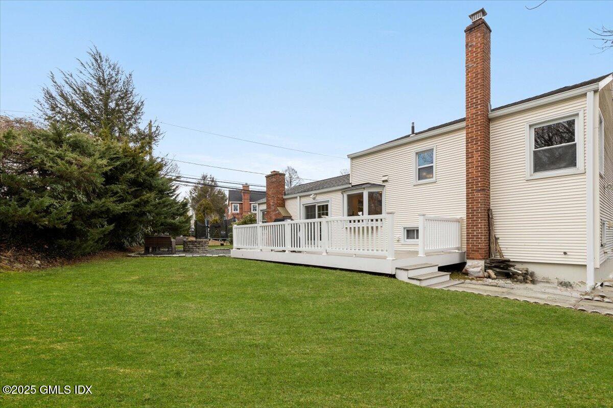 12 Mary Lane Riverside, CT 06878 - Photo 20 of 26 a view of a house with a yard and sitting area