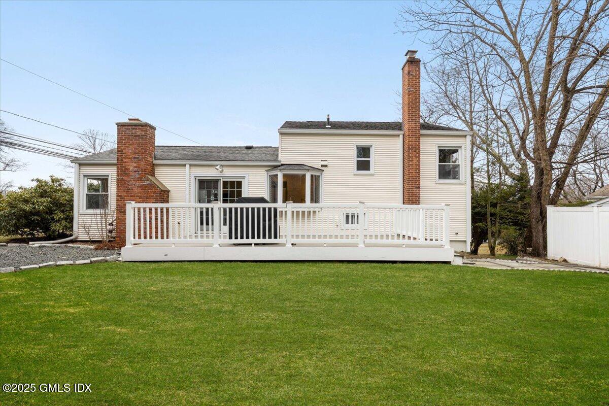 12 Mary Lane Riverside, CT 06878 - Photo 21 of 26 a view of a house with a big yard and large trees