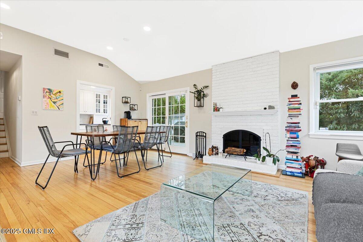 12 Mary Lane Riverside, CT 06878 - Photo 4 of 26 a living room with furniture a fireplace and a table