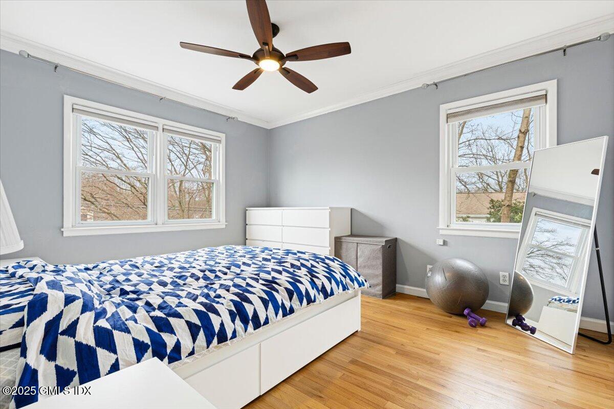 12 Mary Lane Riverside, CT 06878 - Photo 10 of 26 a bedroom with a bed and wooden floor