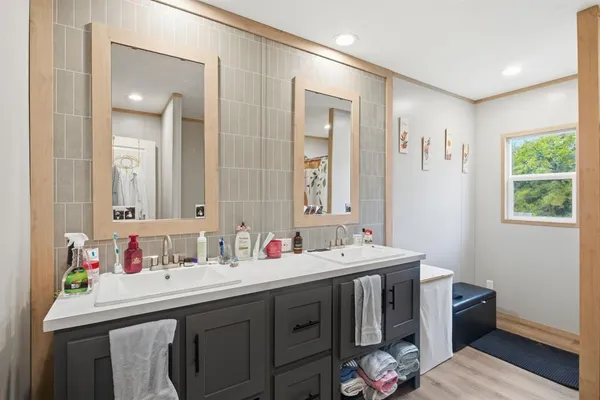 a bathroom with a sink and a mirror