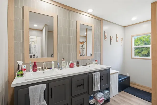 a bathroom with a sink and a mirror