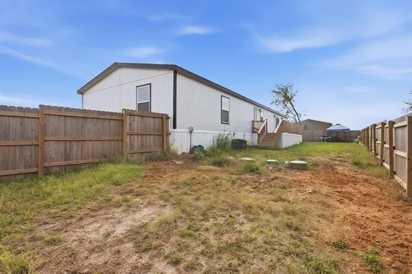 a view of a backyard with a garden