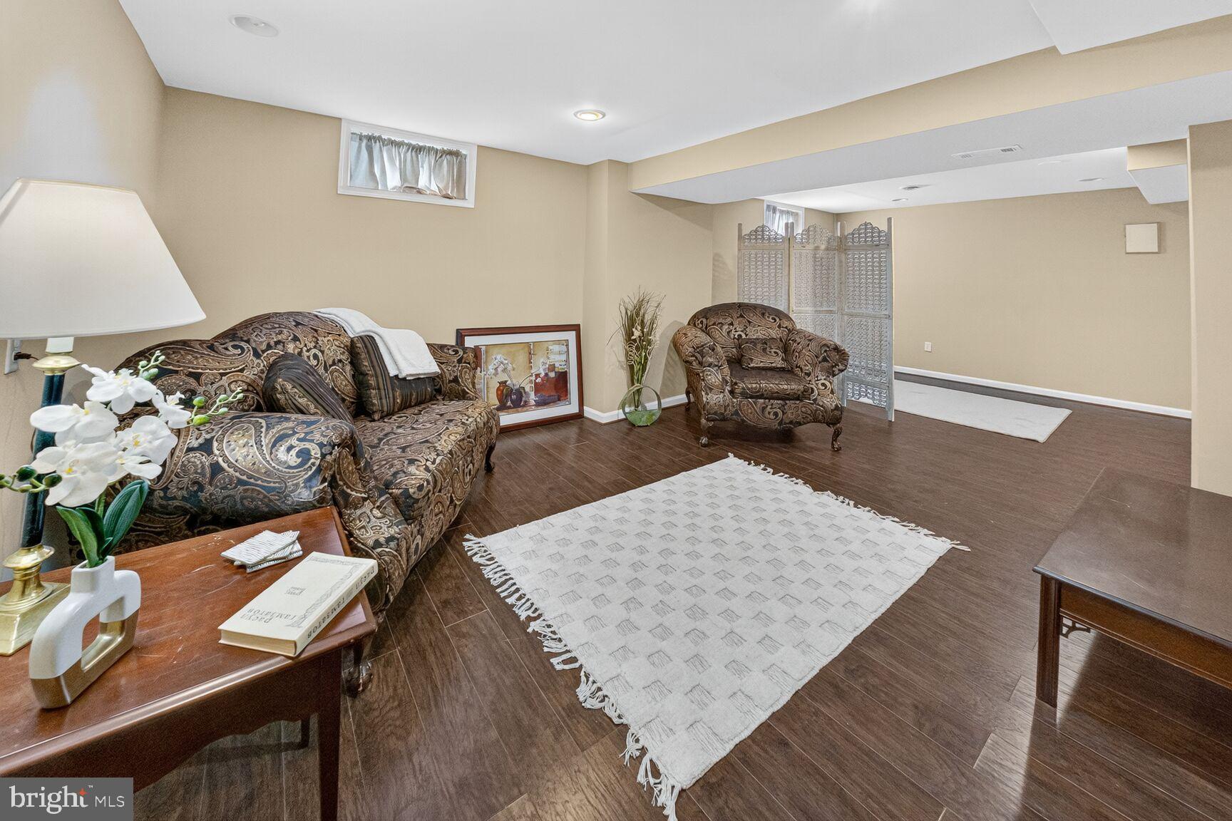 6117 Osborn Road Landover, MD 20785 - Photo 2 of 18 Cozy basement retreat with warm tones.