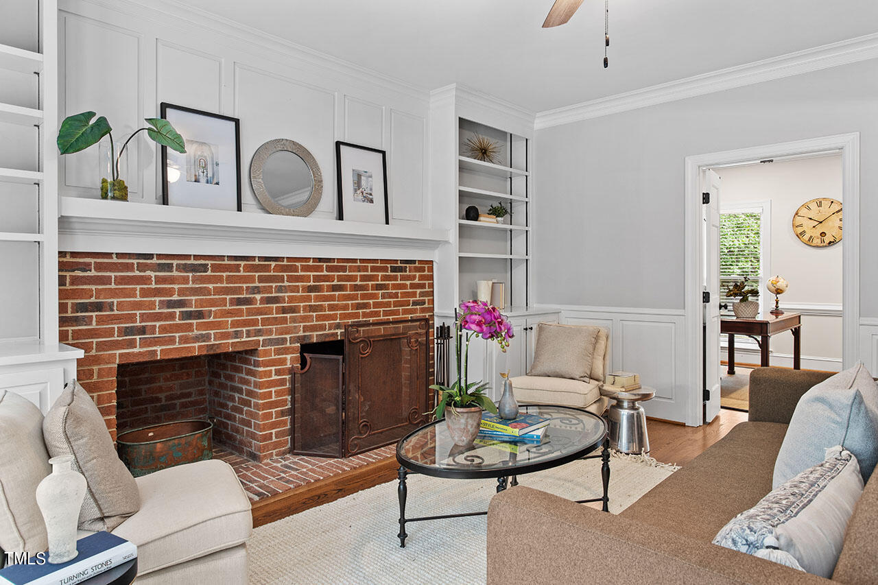 2408 Heartley Drive Raleigh, NC 27615 - Photo 11 of 41 a living room with furniture and a fireplace