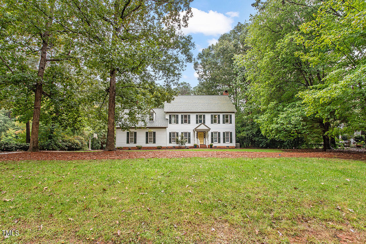 2408 Heartley Drive Raleigh, NC 27615 - Photo 2 of 41 a front view of a house with a garden