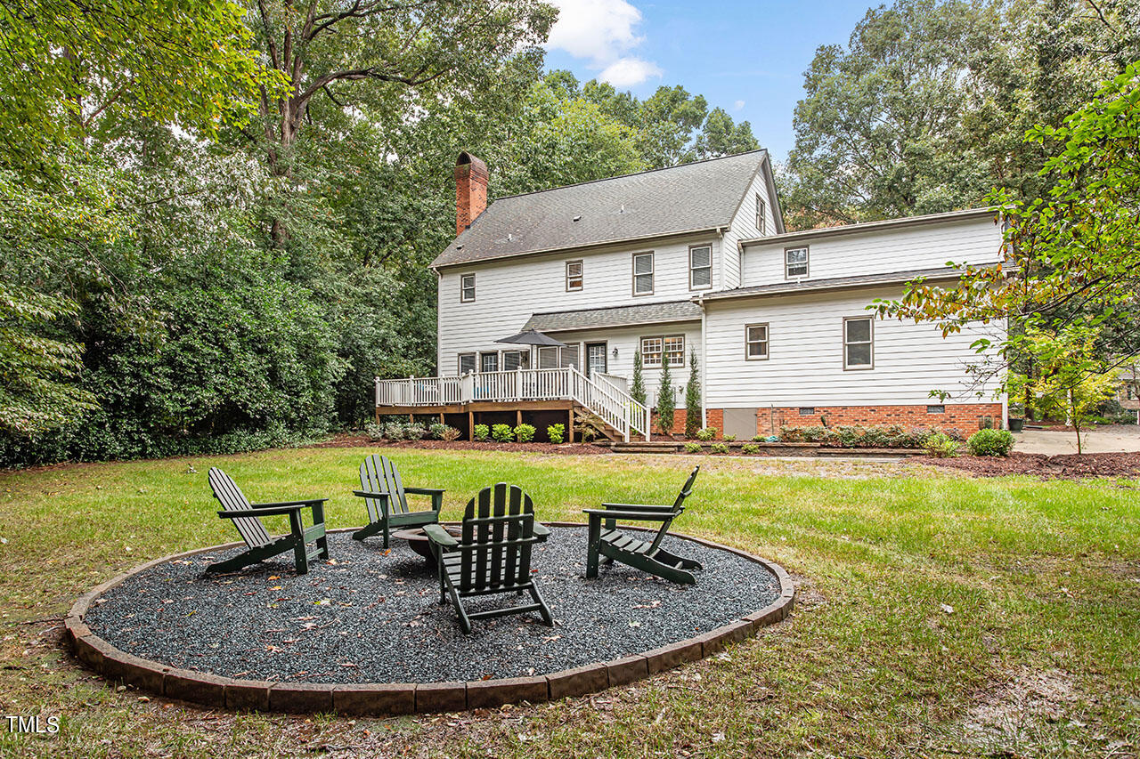 2408 Heartley Drive Raleigh, NC 27615 - Photo 40 of 41 a view of a house with swimming pool and a yard
