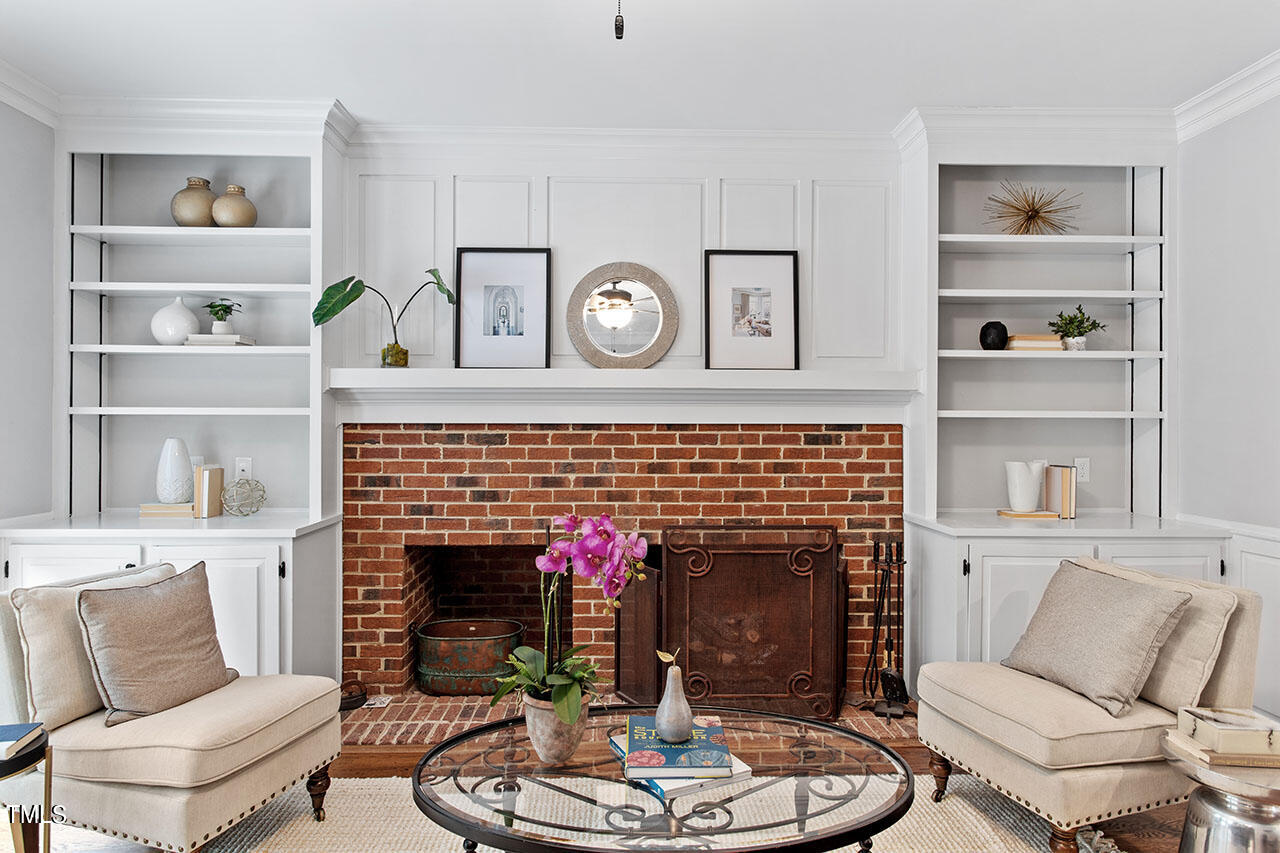 2408 Heartley Drive Raleigh, NC 27615 - Photo 9 of 41 a living room with furniture and a fireplace