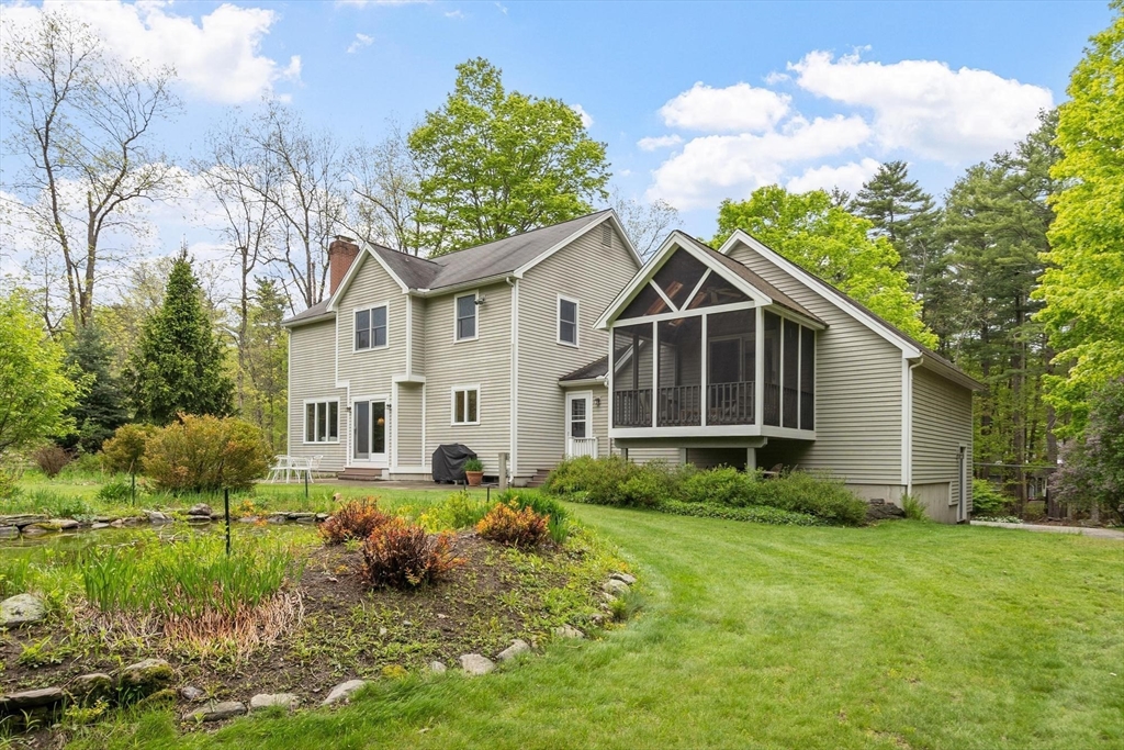 94 Turner Road Townsend, MA 01469 - Photo 31 of 42 a view of a house with a big yard potted plants and large tree