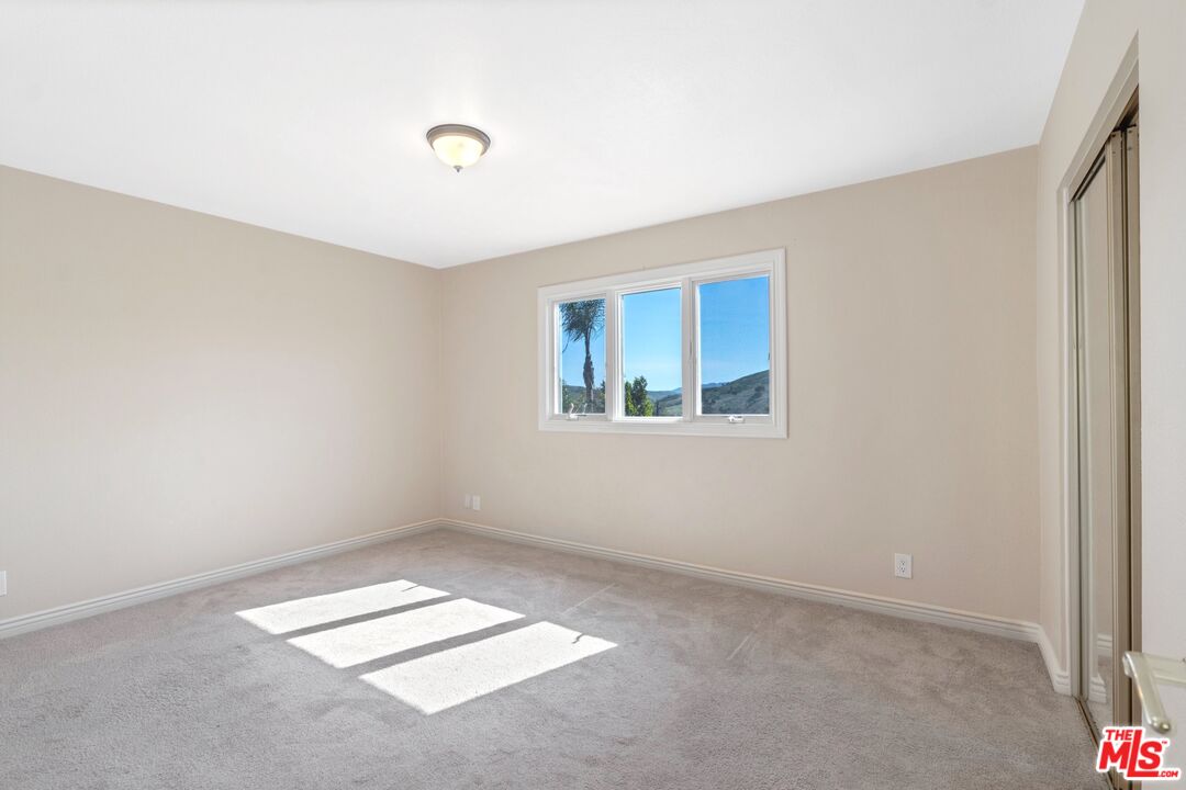 5703 Parkmor Road Calabasas, CA 91302 - Photo 16 of 29 a view of an empty room with a window