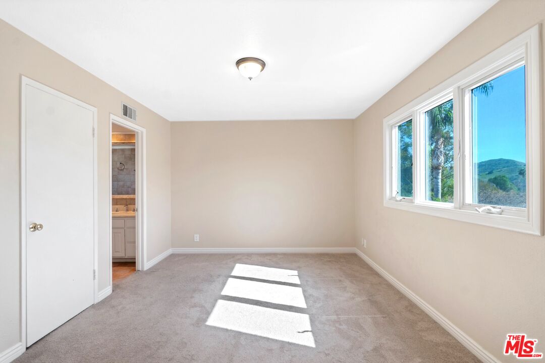 5703 Parkmor Road Calabasas, CA 91302 - Photo 17 of 29 an empty room with windows