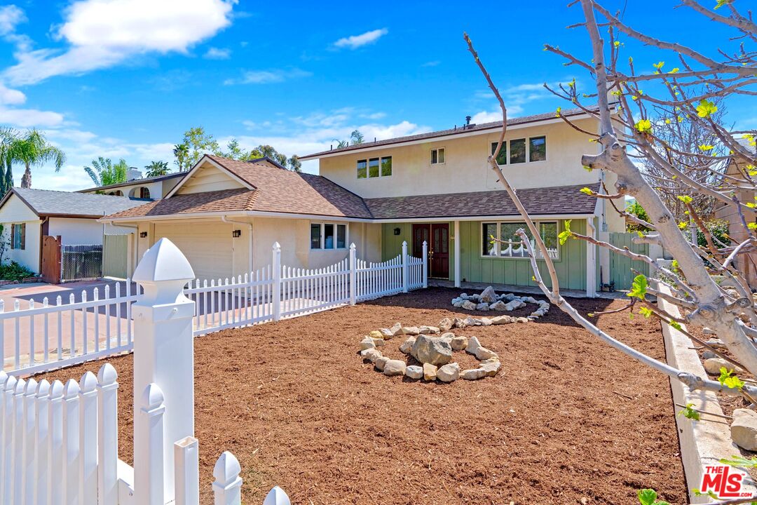 5703 Parkmor Road Calabasas, CA 91302 - Photo 2 of 29 a front view of a house with a yard