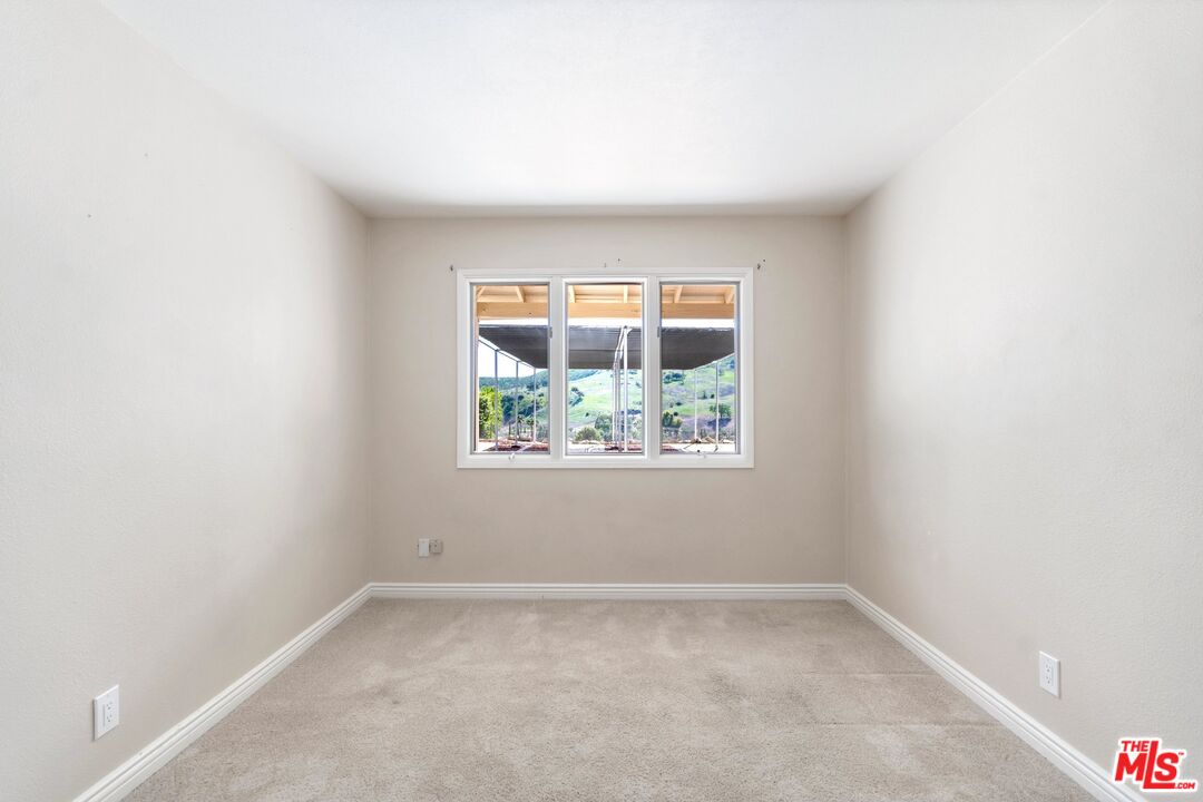 5703 Parkmor Road Calabasas, CA 91302 - Photo 23 of 29 an empty room with a window