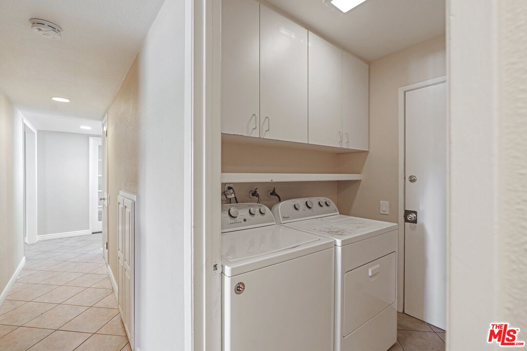 5703 Parkmor Road Calabasas, CA 91302 - Photo 26 of 29 a view of utility room with washer and dryer