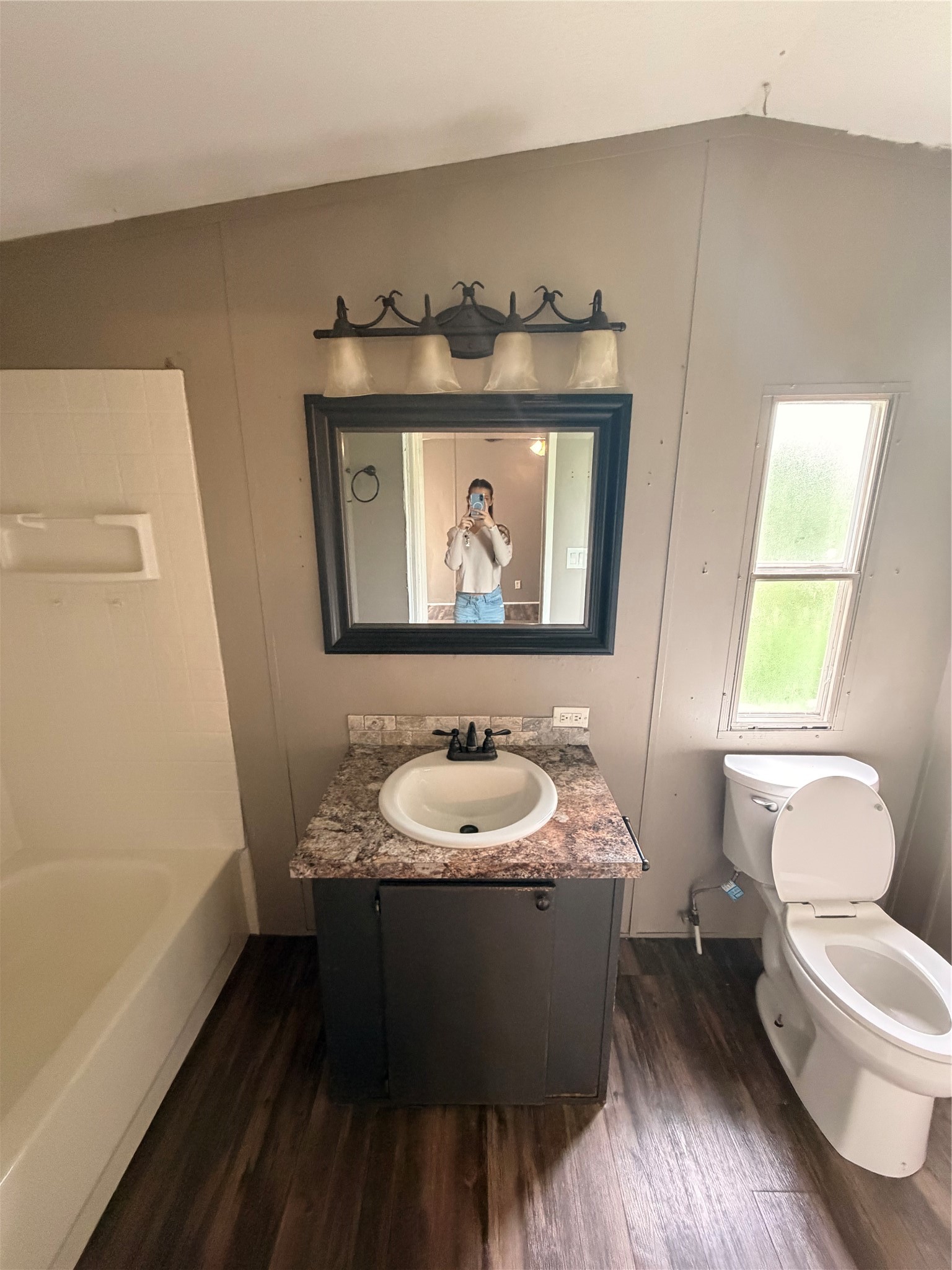2021 North Battlebell Road, Unit 40 Highlands, TX 77562 - Photo 15 of 19 a bathroom with a sink and a mirror