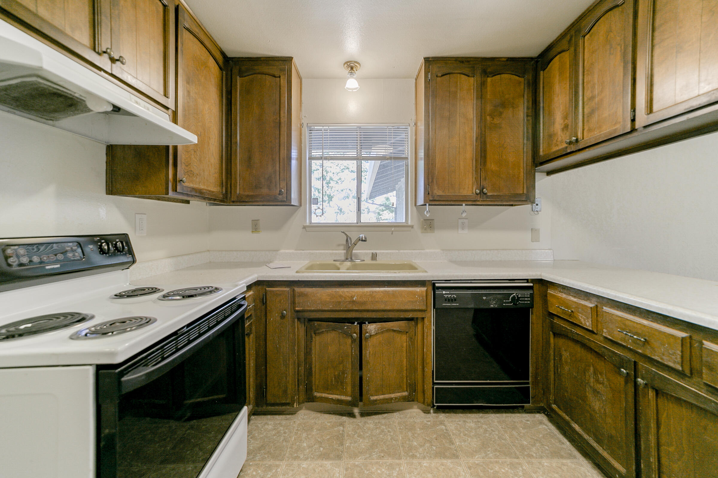 3681 Echo Road Redding, CA 96002 - Photo 6 of 19 a kitchen with a sink stove and cabinets
