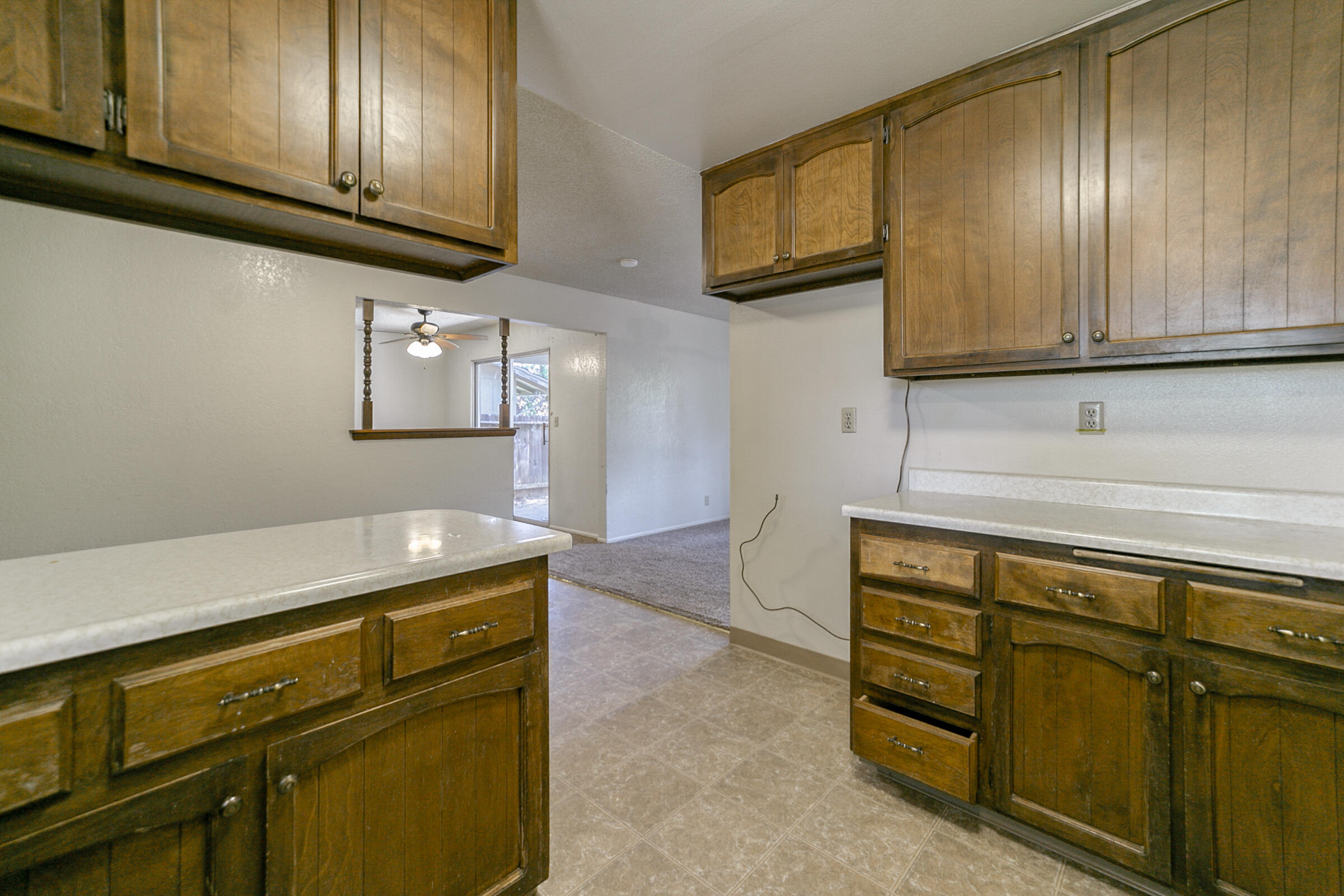 3681 Echo Road Redding, CA 96002 - Photo 7 of 19 a kitchen with granite countertop cabinets stainless steel appliances and a counter space