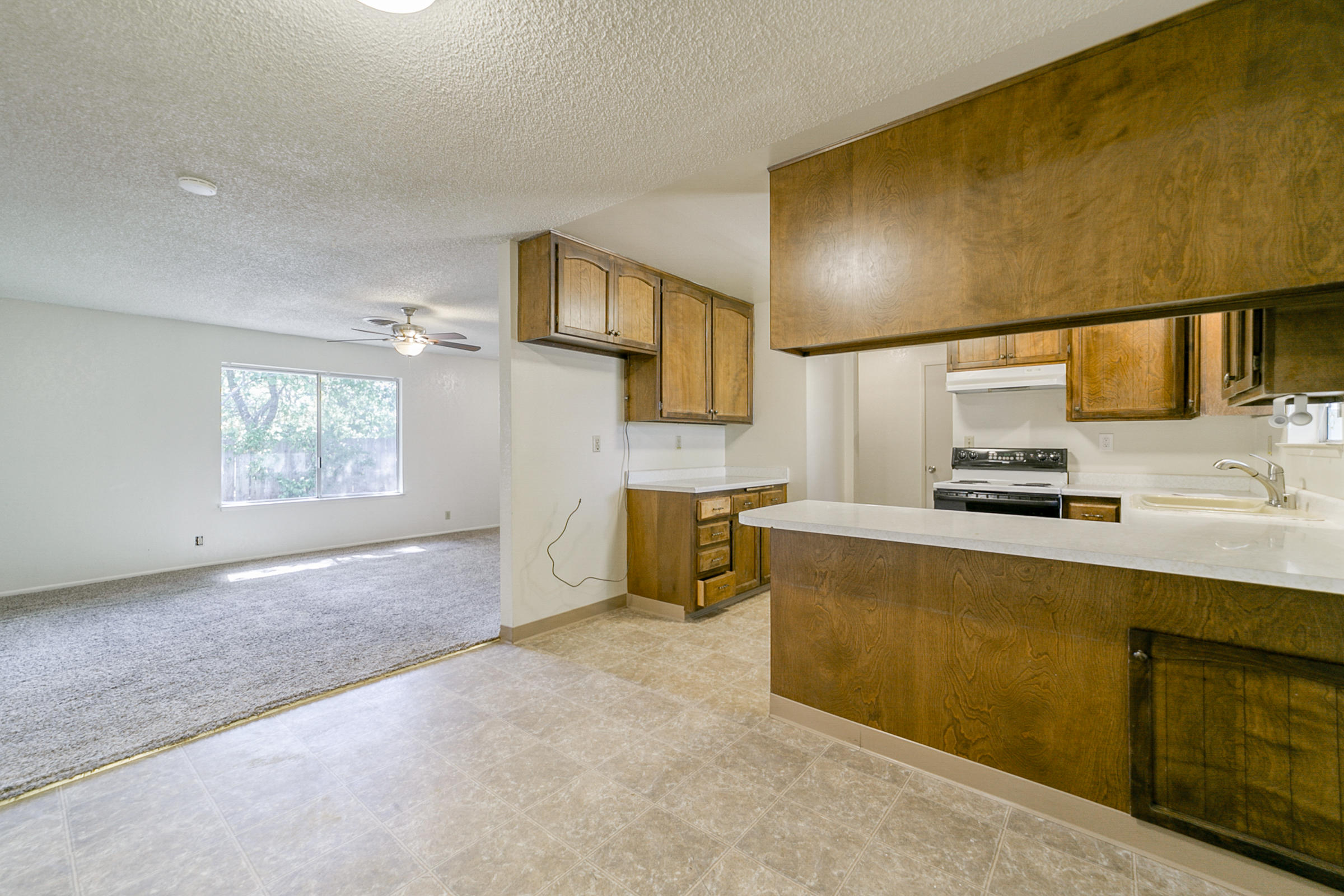 3681 Echo Road Redding, CA 96002 - Photo 8 of 19 a kitchen with stainless steel appliances a sink stove and cabinets