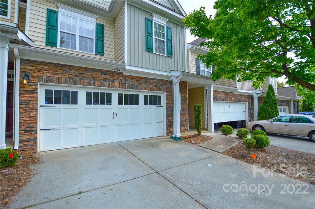 12110 Red Rust Lane Charlotte, NC 28277 - Photo 1 of 36 a front view of a house with garden