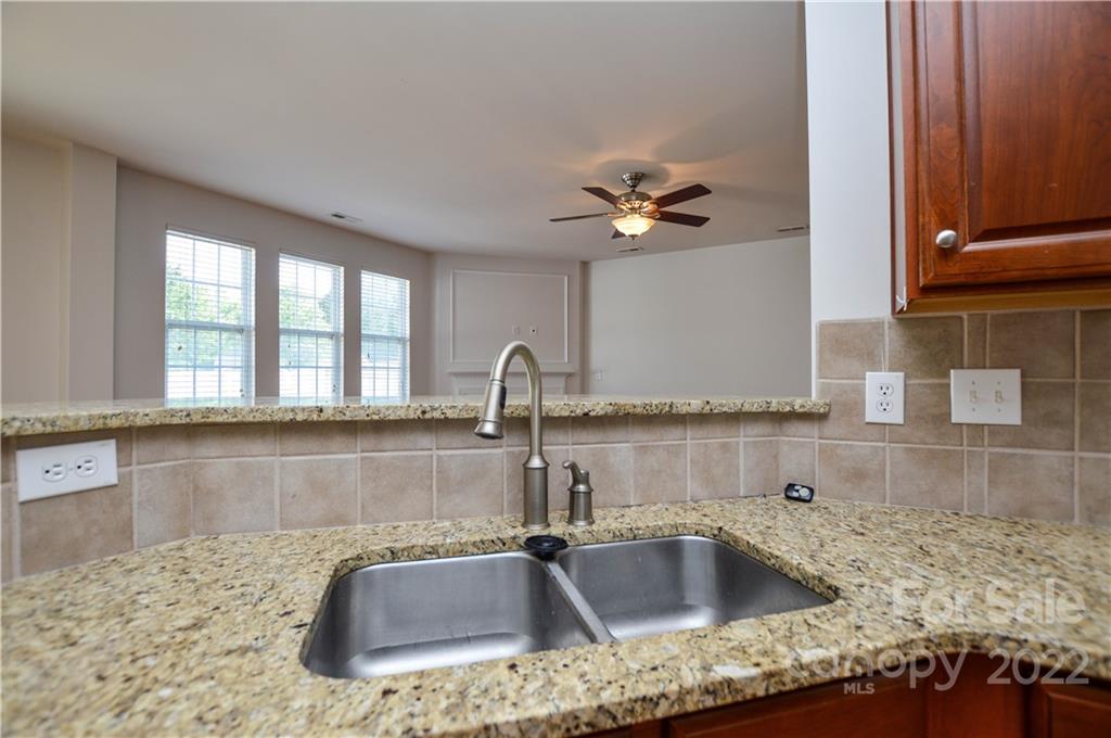 12110 Red Rust Lane Charlotte, NC 28277 - Photo 13 of 36 a kitchen with granite countertop a sink and a stove